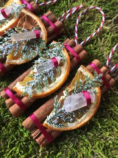 three orange slices with christmas decorations on them