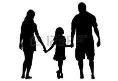 silhouette of a family holding hands