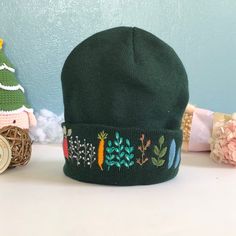 "The embroidered beanie hat is handmade one stitch at a time on the hat. It is embroidered only on the front. 🧶 Measurement: approximate 7\"-8\" in length. 🧶 Washable alone with the laundry bag, gentle or dedicated cycle. 🧶 DO NOT DRY by DRYER; HANG DRY ONLY! 🌸 Thanks for visiting my little shop, located in Pittsburgh, PA! Please do not hesitate to contact me if I could further assist/information on this item." Embroidered Winter Hats, Winter Cotton Bonnet Cap, Cotton Winter Bonnet, Winter Cotton Brimmed Hat, Casual Adjustable Beanie With Embroidered Logo, Winter Cotton Bonnet Hat, Winter Cotton Bonnet, Adjustable Beanie With Embroidered Logo, Warm Cotton Beanie Hat