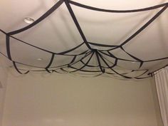 the ceiling is decorated with black wires and spider webs