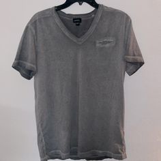 Diesel Acid Washed Gray Short Sleeve Shirt With Pocket Gray Relaxed Fit V-neck Shirt, Casual Washed Gray Tops, Casual Distressed V-neck Top, Casual Distressed Cotton Top, Casual Distressed Short Sleeve Tops, Casual Distressed Gray Tops, Casual Distressed Short Sleeve Shirt, Casual Distressed Cotton Shirt, Casual Cotton Distressed Shirt