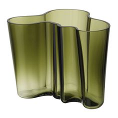 three green glass vases sitting next to each other