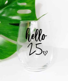 a wine glass with the word hello 25 printed on it