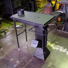 a table with a cup on it in a garage