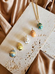 This 18K Easter egg necklace, Easter jewelry, Easter eggs, Colorful egg necklace, Easter gift, Stainless steel, tarnish resistant, One of a kind looks so so so cute! It is made with 18k box chain (1.5mm) and an egg pendant.  The chain is 18k (vacuum-plated on stainless steel) and won't get tarnished for years. If you want to learn more about vacuum plating vs. regular plating, and stainless steel vs. sterling silver, please read the following third-party websites: https://www.bendplating.com/gol Egg Jewelry, Egg Necklace, Easter Necklace, Easter Jewelry, Oyster Pearl, Baroque Pearl Necklace, Holiday Inn, Third Party, Jewelry Creation