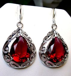 Simulated Red Ruby Earrings  Big Teardrop Design#E28 Custom Made This is a brand new Art Nouveau/Victorian inspired filigree sterling silver pair of teardrop simulated red ruby earrings. The gorgeous 12ctw red gemstones are 16mm (5/8") by 12mm (1/2") in size each. The earrings are marked 925 for sterling silver and are 1-11/16" long by 13/16" wide. Notice the beautiful swirl like craftsmanship of the silver filigree settings. This is a well made beautiful pair of silver earrings and they are rea Red Teardrop Drop Earrings, Red Teardrop Earrings For Anniversary, Red Ruby Earrings, Stylish Earrings, Gem Earrings, Gothic Accessories, Filigree Earrings, Red Gemstones, Cheque Design