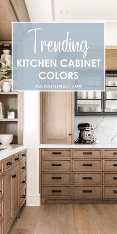 a kitchen with wooden cabinets and white counter tops, the words trending kitchen cabinet colors