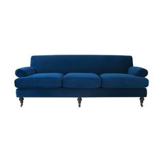 a blue couch sitting on top of a white floor