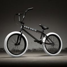 a black and white photo of a bike