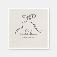 a white napkin with a ribbon tied around it and the words enjoy bridal shower written on