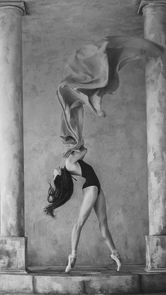 a woman in a leotard doing a handstand on some steps with a cloth draped over her head