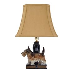 a lamp with a dog figurine on it