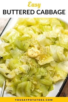 a white plate topped with cabbage covered in butter and seasoning next to a fork