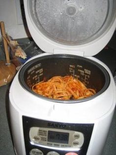 the food is being cooked in the rice cooker