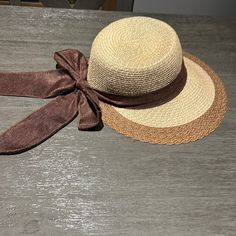 Cute Straw Hat With Dark Brown Bow Detail. Never Worn Adjustable Brown Visor Bucket Hat, Vintage Brown Sun Hat For Vacation, Brown Brimmed Mini Hats For Summer, Brown Bucket Hat For Summer, Brown Visor Sun Hat One Size Fits Most, Brown Summer Bucket Hat, Brown Visor Sun Hat One Size, Vintage Beach Visor Hat, Brown Wide Brim Cloche Hat For Vacation