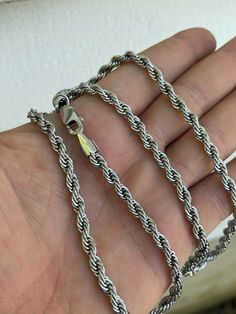 Nice classic rope chains.
Best quality stainless steel. Finished in rhodium for a lustrous lookWhether you wear it alone or with your favorite pendant you will love this chain!We offer 18-30" in 2mm 3mm 4mm 5mm or 6mm.Wear it as a choker or as a longer chain!Nice solid weight to the chain!Your friends will never believe how much you paid for this chain!You can swim in the chain or wear cologne...will never change colorLifetime warranty as is to be expected with an authentic Harlembling product White Gold Rope Chain Necklace, Silver Stainless Steel Rope Chain Necklace, Stainless Steel Rope Chain Necklace, Silver Stainless Steel Rope Chain Jewelry, Stainless Steel Rope Chain Necklace For Gift, Rope Chain Necklace, Never Change, Long Chain, Rope Chain