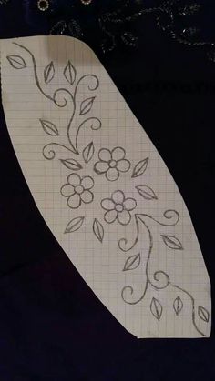 a piece of paper with flowers drawn on it