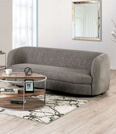 a living room scene with focus on the couch and coffee table in the center area