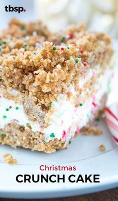 a close up of a piece of cake on a plate with candy canes in the background