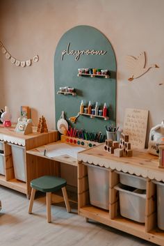 a child's playroom with toys and crafting supplies on the desks