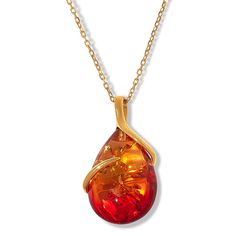 Amber Extraordinaire Gold-Plated Pear Ombré Stone Pendant A single, sterling vine stretches around the glistening amber showcased on this pendant with chain pairing, such a romantic find.           Pendant approx. 1-1/2"L x 3/4"W     Chain approx. 18"L x 1/16"W with 1-1/2" extender     Stamped .925 sterling silver; gold plating; polished finish      Pendant: fixed, pull-through bail     Anchor-link chain with amber accent bead: spring-ring clasp     Stone Information       All sizes and weights approximate     Pressed Ombre Baltic Amber: Pear-shaped (30x20mm), smooth bead (6mm); collected in Poland     Pressed Sunset Ombre Baltic Amber: Pear-shaped (30x20mm), smooth bead (6mm); collected in Poland     Pressed Aqua Blue Ombre Baltic Amber: Pear-shaped (30x20mm), smooth bead (6mm); collected Amber Necklace With Polished Finish For Anniversary, Baltic Amber Necklaces As Gifts, Pear-shaped Orange Jewelry Gift, Orange Pear-shaped Jewelry For Gifts, Amber Teardrop Jewelry For Anniversary, Teardrop Baltic Amber Necklace In Amber Color, Teardrop Baltic Amber Necklace, Baltic Amber Drop Jewelry As Gift, Baltic Amber Drop Jewelry For Gifts