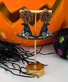 Get ready to charm the season with the Preppy Witch Earrings! These adorable post-back earrings feature a classic witch hat adorned with a stylish bow, adding a preppy twist to your Halloween wardrobe. Perfect for anyone who loves to mix a bit of fashion with their spooky season flair, these earrings are a fun and festive way to celebrate Halloween with a touch of elegance. Whether you're dressing up or keeping it casual, these earrings will cast a spell on your style. Preppy Witch, Witch Earrings, Cast A Spell, Witch Hat, Tassel Earrings, Spooky Season, Witch, Dress Up, Twist