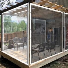 a covered patio area with chairs and tables