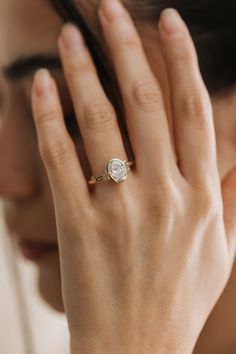 a close up of a person wearing a ring