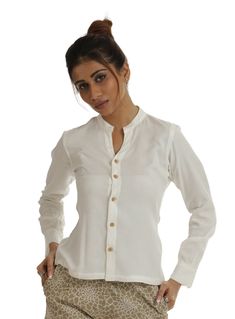 Kuteera's Hera OFF-White Bamboo and Banana Shirt, made from a fabric blend that includes natural bamboo, shows our commitment to sustainability. Bamboo is renowned for its eco-friendly qualities. This stylish shirt features a Chinese collar design and is complemented with wooden buttons, adding a touch of sophistication to your attire. With its elegant white color, it effortlessly enhances any ensemble. Moreover, this shirt offers remarkable comfort for daily wear, as it is highly breathable and Traditional Button-up Cotton Blouse, Long Sleeve Cotton Blouse Piece, Traditional Long Sleeve Shirt For Daywear, Elegant Long Sleeve Cotton Blouse Piece, Elegant Long Sleeve Cotton Blouse, Traditional White Linen Blouse, Traditional Cotton Workwear Tops, Traditional Fitted Button-up Top, Traditional Long Sleeve Linen Tops