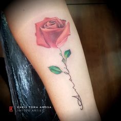 a rose with the word love written in cursive writing and a green leaf