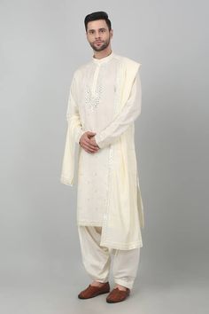 Cream cotton kurta with all over geometric pattern, tonal thread, metallic sequin and mirror embroidery. Paired with contrast cowl draped patiala pant and embroidered bordered dupatta. - Aza Fashions Patiala Pant, Mirror Embroidery, Kurta Set For Men, Cotton Kurta, Kurta Set, Aza Fashion, Geometric Pattern, Sequin, Thread