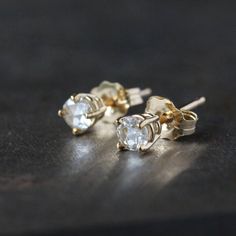 Stunning rose cut diamonds shine from modern prong settings in these gorgeous earrings. This is solid 14k gold, recycled and refined in the U.S. The diamonds are .15 carats each (3.5mm), 1/3 carat total weight, SI1, G-H color, and 100% conflict-free. The studs come with 14k gold tension backs, as pictured. You can choose from 14k yellow or 14k rose gold. A rose-cut diamond has a flat base and a crown made up of triangular facets that are symmetrically arranged and rise to form a point at the top Diamond White Rose Cut Diamond Earrings As Gift, White Gold Diamond Earrings With Rose Cut, Anniversary White Gold Rose Cut Diamond Earrings, 14k White Gold Earrings With Rose Cut Diamonds, 14k Gold Earrings With Rose Cut Diamonds For Anniversary, Rose Cut Diamond Earrings For Gift, Gift Rose Cut Diamond White Earrings, White Gold Round Cut Diamond Earrings With Rose Cut, Rose Cut Diamond Earrings For Anniversary