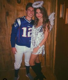 a man and woman dressed up in football uniforms