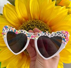 a sunflower with sunglasses that say it's my birthday on the front and side