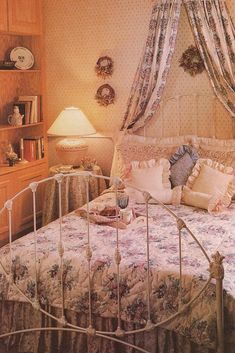 a bedroom with a bed, dresser and lamp in it's centerpieces