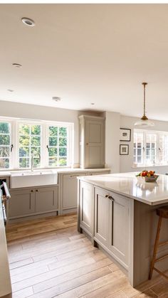 a large kitchen with an island in the middle