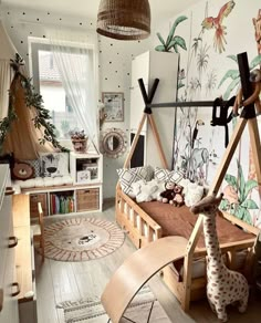 a child's bedroom decorated in white and wood