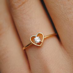 A pretty 0.07ct round brilliant diamond, set inside a heart silhouette, this ring is crafted in 14k solid gold and is a treat to the eyes and heart. * Diamond Wt. : 0.07 Cts * Color-Clarity Grade : H-I - Vs-Si * Gold - 14kt, 1.2 gms Solid Yellow Gold Find us on Instagram for exquisite designs: @abhikajewels Like us on Facebook: www.facebook.com/Abhikajewels Thank you for visiting our shop.. :) Heart Shape Ring Design, Heart-shaped Diamond Birthstone Ring, Valentine's Day Single Diamond Ring In Fine Jewelry Style, Heart Shape Ring Design Gold, Heart Ring With Single Diamond In Round Cut, Heart Shaped Single Diamond Gift Ring, Heart-shaped Single Diamond Ring Gift, Heart-shaped Single Diamond Gift Ring, Heart Shaped Single Diamond Ring For Gift