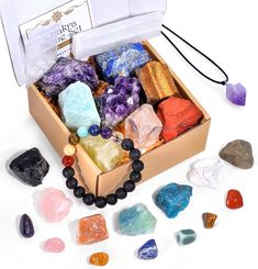 PRICES MAY VARY. AUTHENTIC HEALING CRYSTALS SET - Crystals and Healing Stones including 7 raw chakra stones(clear quartz, amethyst, lapis lazuli, Amazonite, tiger's eye, citrine, red jasper), 7 colorful gemstones (howlite/white turquoise, rose quartz crystal, apatite, fluorite, pyrite, red aventurine, obsidian), 7 mini Tumbled Chakra Stones, Amethyst Cluster, Crystal Necklace, Selenite Plate, Lava Bracelet, Crystal Guide, and a Beautiful Box. The real stones are ethically sourced from the nature Healing Crystals Meanings, Bracelet Gift Box, Amethyst Crystal Necklace, Lava Bracelet, Crystal Healing Stones, Chakra Crystals, Rose Quartz Crystal, Amethyst Necklace, Chakra Stones