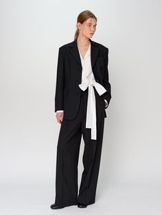 The Wide Slacks are a chic and modern addition to any fashion-forward wardrobe. This product offers a sleek, wide-leg silhouette that enhances both comfort and style. They are perfect for creating a sophisticated yet relaxed look, suitable for various occasions. - These wide slacks feature a high-rise waist, providing a flattering fit and elongating the legs.- The slacks are crafted from high-quality fabric, ensuring durability and comfort throughout the day.- They include front and back pockets, adding practicality to the stylish design.- A handmade Cali medal decoration has been attached to the lower right side of the front panel to add a unique point of interest. Modern Tailored Wide Leg Pantsuit, Classic Wide-leg Office Pantsuit, Sleek Wide-leg Pantsuit For Business, Sleek Wide Leg Pantsuit For Business, Modern Formal Wide-leg Pantsuit, Modern Business Casual Pantsuit, Chic Business Wide Leg Ankle-length Pants, Modern Tailored Wide-leg Pantsuit, Sleek Business Casual Wide Leg Pantsuit