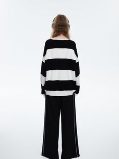 Details: Long sleeve viscose sweatshirt in black & white stripes Round neck Ribbed cuffs and hem Dropped shoulders "Amour" patch embroidered on chest Oversized fit Materials & Care: 76% Viscose, 24% Polyester Hand wash | Dry clean Do not bleach Size & Fit: Model is 5'7", Bust 32, Waist 24, Hips 35, wearing a size S Item #: JM1KT08 Casual Black Sweater With Striped Cuffs, Black Long Sleeve Tops With Striped Hem, Black Long Sleeve Top With Striped Hem, Oversized Winter Tops With Contrast Stripes, Winter Oversized Tops With Contrast Stripes, Casual Oversized Top With Striped Cuffs, Striped Sweater With Ribbed Cuffs For Loungewear, Spring Floral Prints, Cotton Pajama Shorts