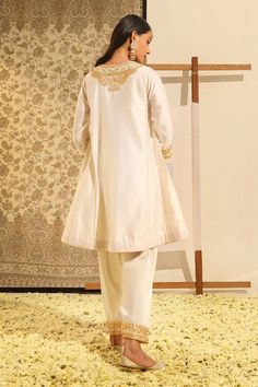 Ivory chauga kurta with floral, paisley embroidery using gota patti, dabka, zardozi work. Paired with a salwar. - Aza Fashions Elegant Fitted Beige Lawn Suit, Elegant Semi-stitched Naqshi Palazzo Set, Elegant Semi-stitched Palazzo Set With Naqshi, Elegant Wedding Palazzo Set With Naqshi, Wedding Silk Palazzo Set With Naqshi, Elegant Beige Chikankari Embroidery Sets, Elegant Beige Sets With Chikankari Embroidery, Naqshi Embroidered Lawn Suit For Reception, White Unstitched Silk Suit