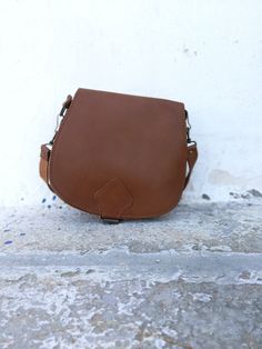 New Brown Saddle bag with adjustable cross body strap. Custom made bag in plenty of colors with adjustable strap. This is the perfect IT bag for this season all across runways and celebrities. Dimensions: SMALL: 20*22 cm MEDIUM: 22*28 cm LARGE: 25*28*10 cm Strap: 125 cm All Bags are made to order. If you like this bag, please see our full collection in the below link: https://www.etsy.com/shop/madammeshushu?section_id=17490770&ref=shopsection_leftnav_3 More on who we are Welcome to my store Saddle Bag With Detachable Strap For Daily Use, Brown Crossbody Saddle Bag With Detachable Strap, Everyday Saddle Flap Bag With Adjustable Strap, Everyday Saddle Bag With Detachable Strap, Everyday Use Saddle Flap Bag With Adjustable Strap, Daily Use Saddle Bag With Adjustable Strap, Travel Saddle Bag With Adjustable Strap, Saddle Bag With Removable Pouch, Saddle Bag With Removable Pouch For Daily Use