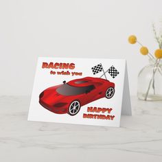 a birthday card with a red sports car