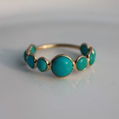 > Material - 18K Solid Yellow Gold > Gemstone - Genuine Turquoise > Gemstone Shape - Cabochons > Stone weight -1.70 ct > Gross weight - 1.3 grams This ring is made to order, so it may take 3-5 days for it to be ready, after the payment is made. Turquoise is perhaps the oldest stone in man's history, the talisman of kings, shamans, and warriors. It is a stone of protection, strong and opaque, yet soothing to the touch, healing to the eye, as if carved from an azure heaven and slipp Elegant Turquoise Ring For Anniversary With Round Band, Elegant Turquoise Ring With Round Band For Anniversary, Elegant Turquoise Ring For Anniversary, Turquoise Ring With Bezel Setting, Turquoise Multi-stone Round Opal Ring, 14k Gold Turquoise Ring For Wedding, Turquoise Bezel Setting Wedding Jewelry, Turquoise Round Bezel Set Jewelry, Turquoise Jewelry With Bezel Setting For Wedding