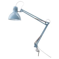 a blue desk lamp on a white background with clippings to the light bulb