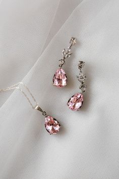 An absolutely stunning dusky blush pink colour teardrop jewellery set.  Simulated diamonds.  Standard 18 inch chain - other lengths available ie 16, 20 inch or add a 2 inch extension- please just add details to order notes otherwise standard 18 inch will be sent.  Earring length approx 1.5 inch.  Silver plated lead and nickel free. ( sterling silver chain )  Beautifully gift boxed Pink Teardrop Pendant Jewelry For Wedding, Delicate Pink Teardrop Jewelry, Elegant Pink Jewelry Sets For Wedding, Pink Teardrop Drop Earrings For Wedding, Pink Sterling Silver Jewelry For Wedding, Pink Teardrop Earrings For Wedding, Pink Drop Earrings For Wedding, Elegant Pink Sterling Silver Jewelry Sets, Pink Teardrop Dangle Earrings For Wedding