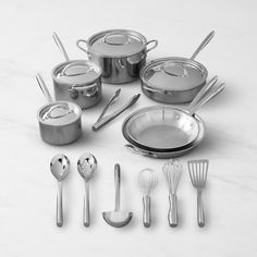 an assortment of kitchen utensils and pans