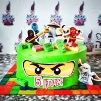 a lego themed birthday cake with characters on it