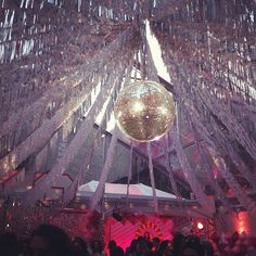 a disco ball hanging from the ceiling at a party